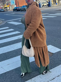 A niche design style coat for women with fashionable granular velvet tassels and patchwork fur strips